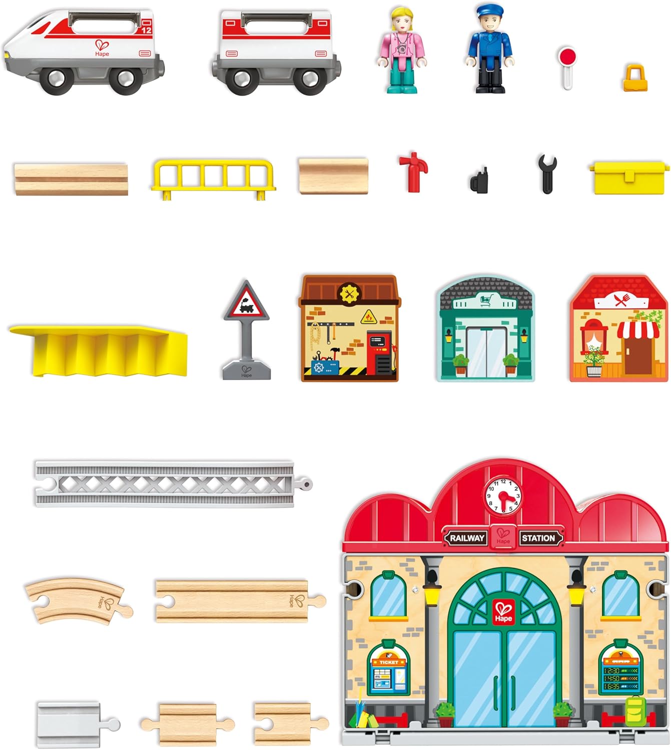 Collection of toy train station and related accessories on a white background