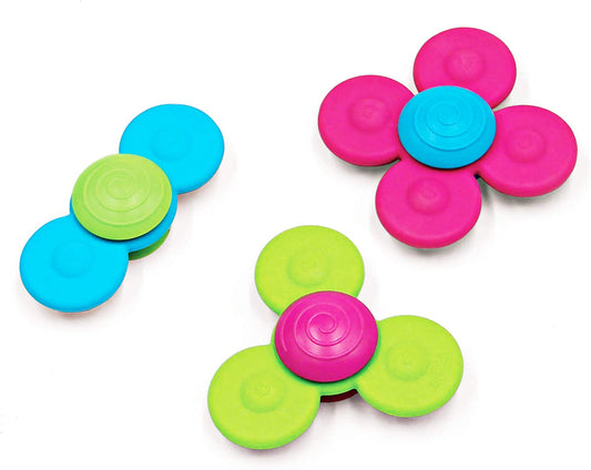 Whirly Squigz. Pink, blue, and green spinner toys for babies and toddlers.