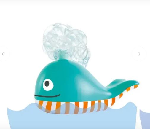 Toy whale with water feature on a white background