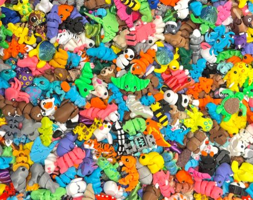 Collection of colorful small figurines and toys.